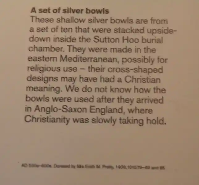 A cross with solar disc on a bowl